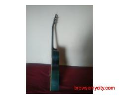 Turquoise semi acoustic guitar
