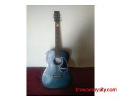 Turquoise semi acoustic guitar